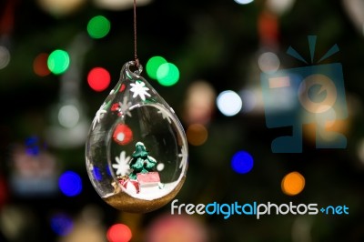 Small Christmas Tree Inside Glass Ornament Hanging On Christmas Tree Stock Photo