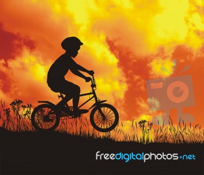 Small Cyclist In Nature Stock Image