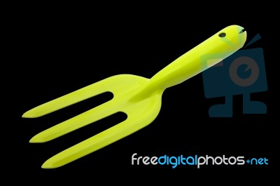 Small Gardening ,  Green Fork Isolated On Black Background Stock Photo