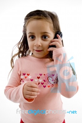 Small Girl Talking On Mobile Stock Photo