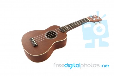 Small Guitar (ukulele) From Body On White Background Stock Photo