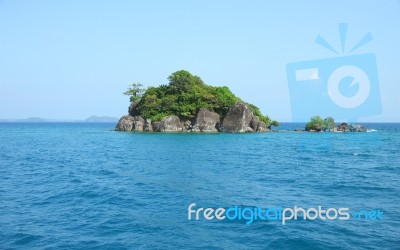 Small Island On Tropical Blue Sea Stock Photo