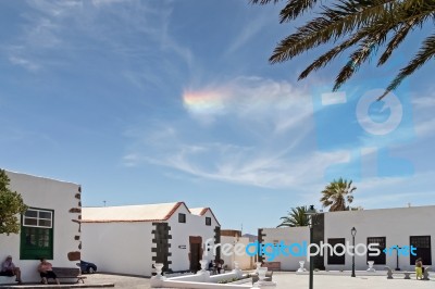 Small Rainbow Cloud Over Teguise Lanzarote Stock Photo