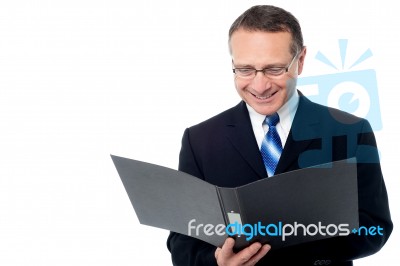 Smart Businessman Holding A Open File Stock Photo