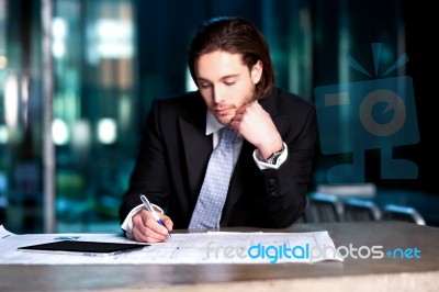 Smart Businessman Projecting His Plans Stock Photo