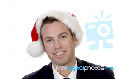 Smart Businessman  With Santacap Stock Photo