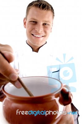 Smart Chef Cooking In Porcelain Pot Stock Photo