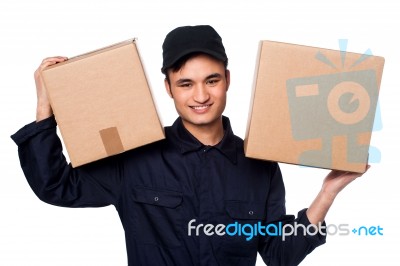 Smart Courier Boy Delivering Parcels Stock Photo