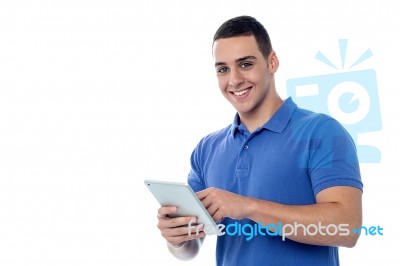 Smart Guy Browsing On His Tablet Device Stock Photo