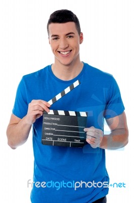 Smart Guy Holding Clapperboard Stock Photo