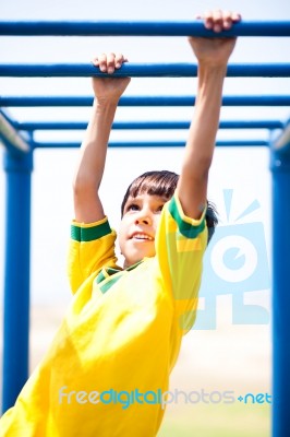 Smart Kid Playing On Jungle Gym Stock Photo