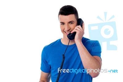 Smart Man Using Telephone Stock Photo