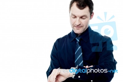 Smart Manager Checking Time On His Watch Stock Photo