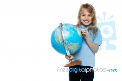 Smart Young Girl Showing Her Country On A Globe Stock Photo