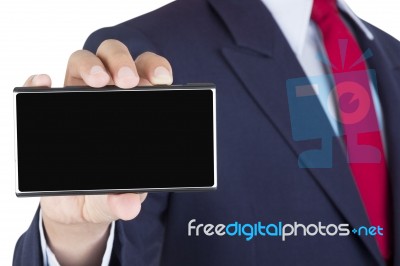 Smartphone On Businessman Hand Stock Photo