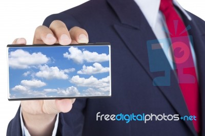 Smartphone On Businessman Hand Stock Photo