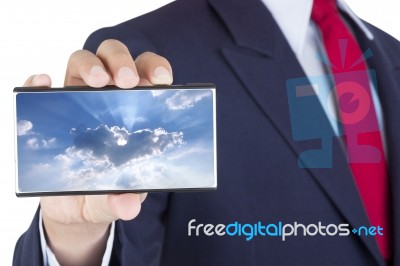 Smartphone On Businessman Hand Stock Photo