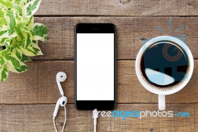 Smartphone White Screen On Wooden Table, Mockup Modern Smartphon… Stock Photo