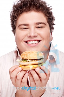 Smiled Chubby And Hamburger Stock Photo