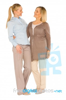 Smiley Grandmother And Young Mother Standing On White Background… Stock Photo