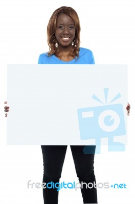 Smiling African Girl Holding Board Stock Photo