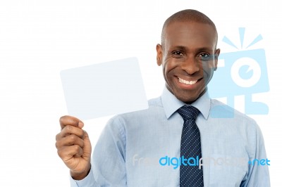 Smiling African Man Holding Blank White Card Stock Photo