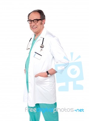 Smiling Aged Doctor Standing Stock Photo