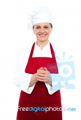 Smiling Aged Female Chef Standing Stock Photo