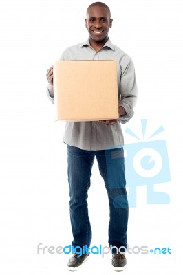 Smiling Aged Holding Carton Box Stock Photo