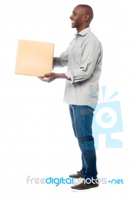 Smiling Aged Holding Carton Box Stock Photo