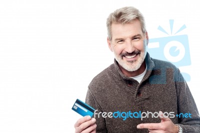 Smiling Aged Man Showing His Debit Card Stock Photo