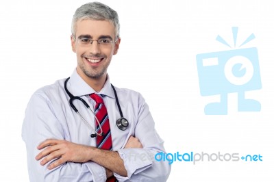 Smiling Aged Physician, Arms Crossed Stock Photo