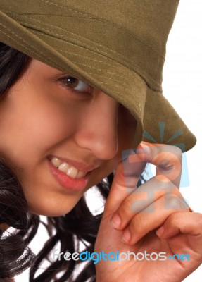 Smiling And Cheeky Girl With Hat Stock Photo