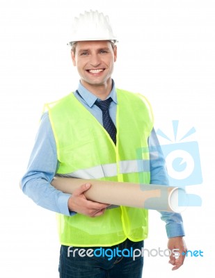 Smiling Architect Holding Blueprint Stock Photo