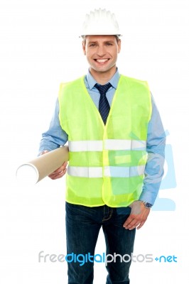 Smiling Architect Holding Blueprint Stock Photo