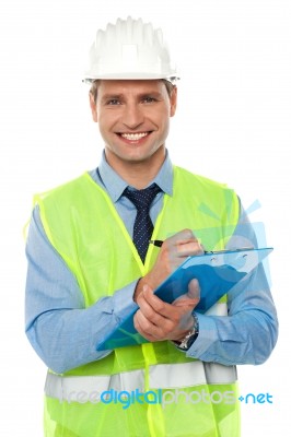 Smiling Architect Holding Clipboard Stock Photo