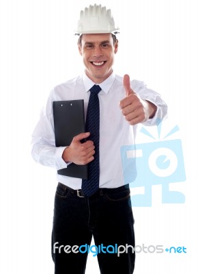 Smiling Architect Showing Thumbs Up Stock Photo