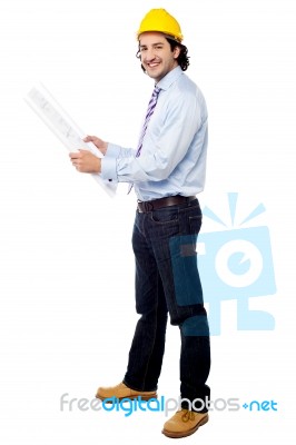 Smiling Architect Studying The Blue Print Stock Photo