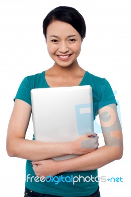 Smiling Asian Female Posing With Laptop Stock Photo