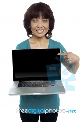 Smiling Asian Woman Pointing Laptop Stock Photo