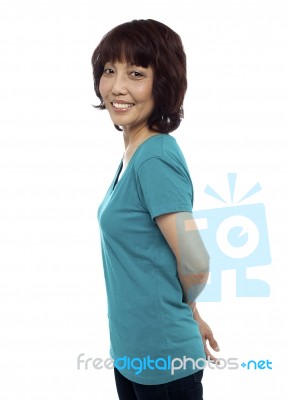 Smiling Asian Woman Standing Stock Photo