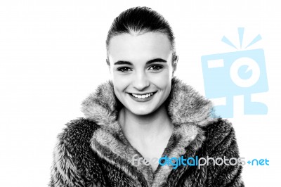 Smiling Attractive Girl In Furry Overcoat Stock Photo