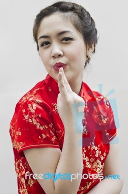 Smiling Beautiful Chinese Young Woman Gesturing Stock Photo