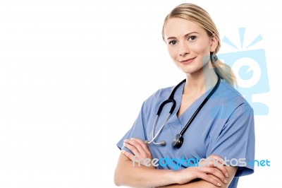 Smiling Beautiful Doctor With Crossed Arms Stock Photo