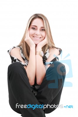 Smiling Blonde Woman Sitting Stock Photo