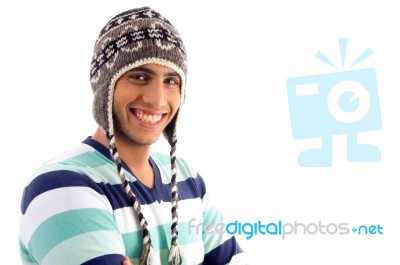 Smiling Boy Covering His Head With Woolen Cap Stock Photo