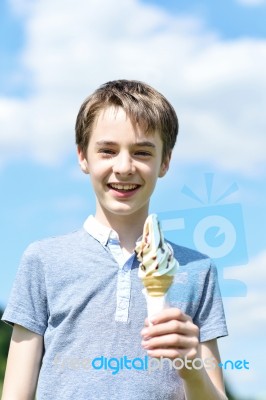 Smiling Boy Posing With An Ice Cream Stock Photo