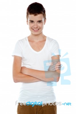 Smiling Boy Posing With Crossed Arms Stock Photo