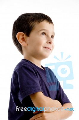 Smiling Boy With Arm Crossed Stock Photo