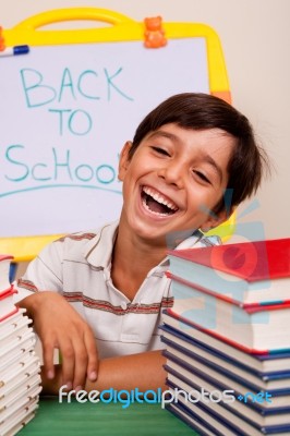 Smiling Boy With School Books Stock Photo